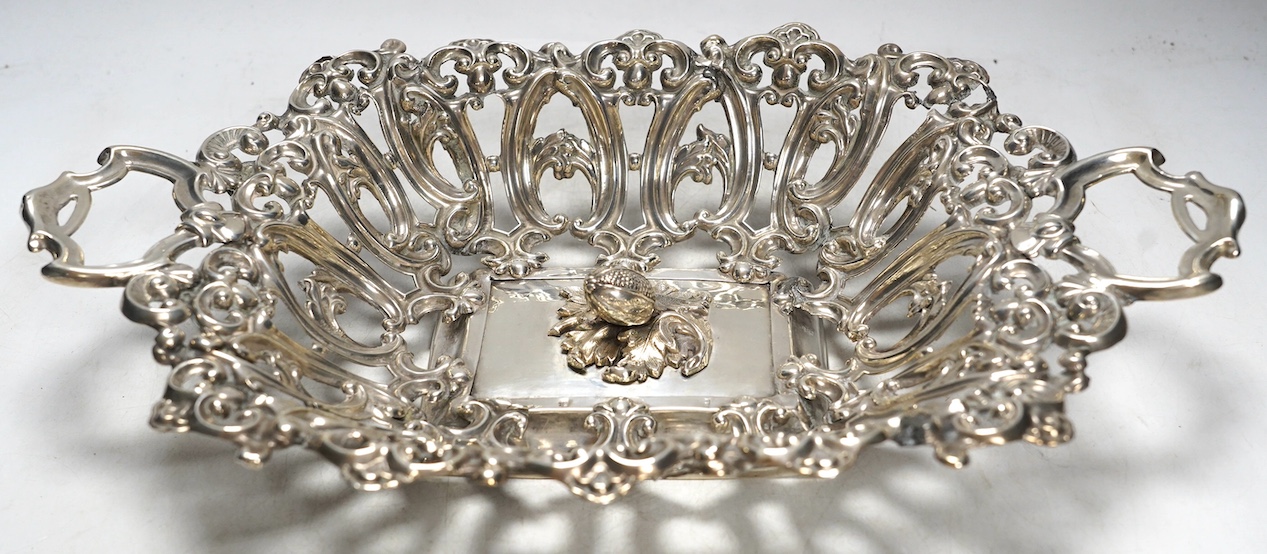 A late 19th/early 20th century Austro-Hungarian pierced 800 white metal fruit bowl, with unusual raised acorn base, 38.4cm, 12.2oz. Condition - poor (repair)